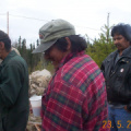 Marvin Meekis, Roland Pemmican and Bruce Rae looking at all that food