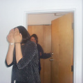 Rochelle hides from the camera, as the girls get ready.