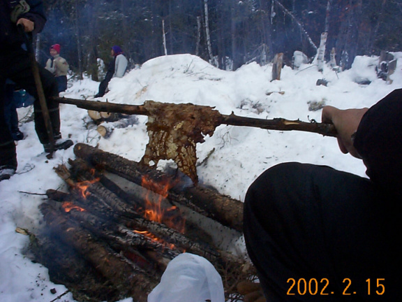 Elder Bill Rae shows us how to roast moose fat over the fire. We all know how rare fat is on a moose. :)