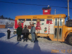 Darlene Meekis, Charilyn McKay (WAHSA Coordinator) and Barb (Grade 7 teacher) pose in front of their float for the Christmas par