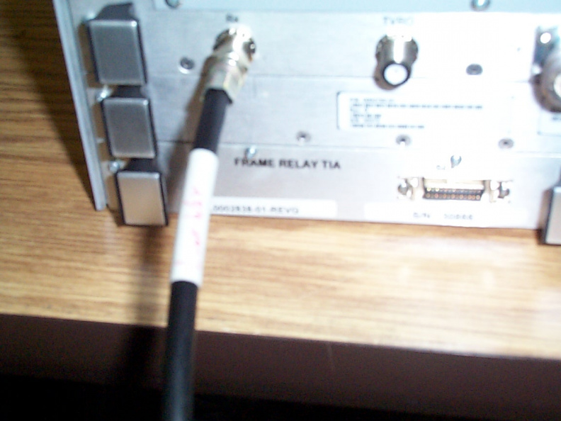 A closeup of where the coaxial cable connects to the Linkway 2100.
Before the new cable can be connect, disconnect the existing cable from this port. The old cable connects to the free port on the 2-way splitter. The cable labelled "Linkway 2100" then connects to this port. aad.jpg