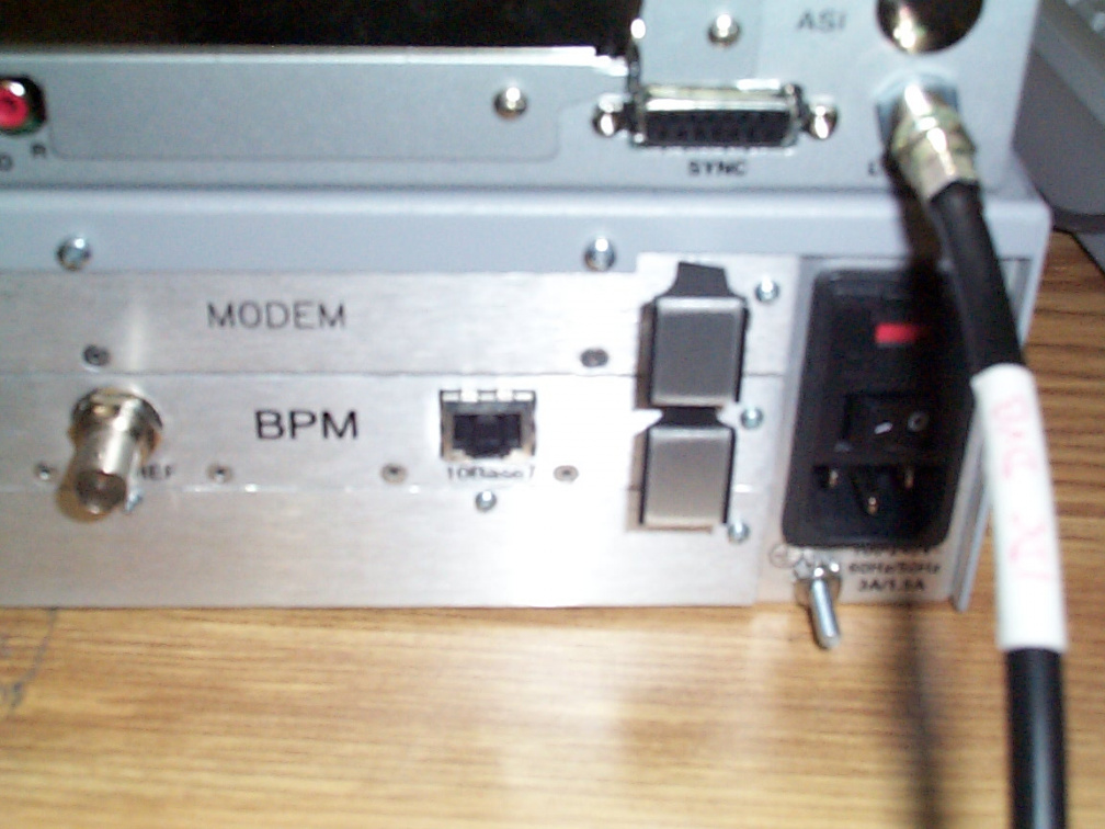 The cable labelled &quot;IDC DVB&quot; connects to the &quot;L Band&quot; port on the IDC SRA2100 DVB IRD.