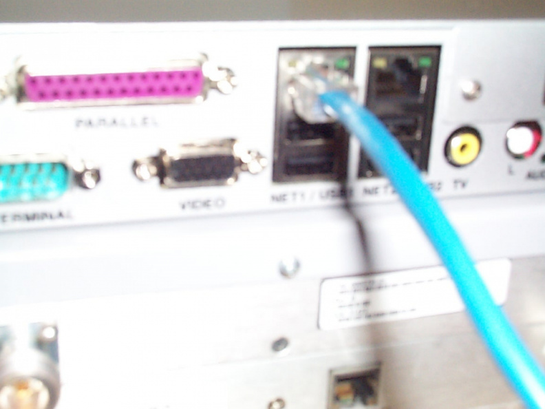 The ethernet cable connects to the &quot;NET 1&quot; port on the IDC SRA2100 DVB IRD. The other end of this ethernet cable needs
