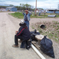 Dale Thompson and Barlow Kakegamic sitting down. Taking a break and waiting for the truck to haul away this garbage.
