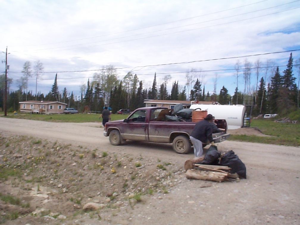 See the guy walking away? That is  Councillor Silas Kakegamic doing his part in earth day and his trusty sidekick Deputy Chief J