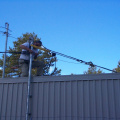 The telco mast was leaning due to the stress of all the fiber runs. A guy wire was installed to secure the mast.