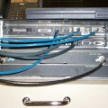 A closeup of the uBR7223 connections. The console and aux ports are connected to the RSM-3 for remote access.