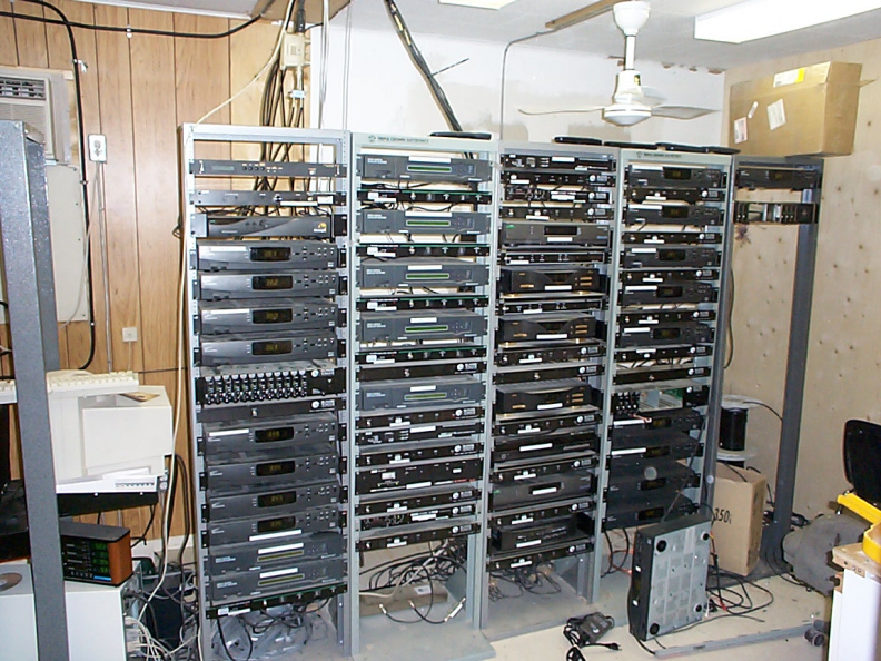 The cable headend equipment. The upconverter is in the left most rack at the very top. The other equipment are satellite receive