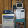 The satellite rack, uBR7223, cable registration server and DirecPC box (K-Net Router).