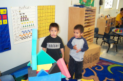 Garcia and Gavin playing with foam blocks.