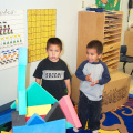 Garcia and Gavin playing with foam blocks.