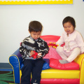 Isaiah and Chayla take a seat while they were playing.