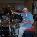 Abraham Monias on the drums. Hamming up for the shot.