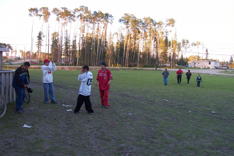here we have the scene of our youths playing and in the background our Keewaywin chief coming to the festivities
