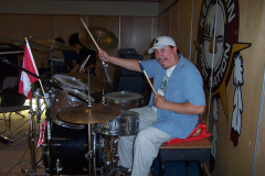 Abraham Monias on the drums. Hamming up for the shot.