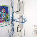 The WiLAN unit feeding the cable headend is at the top. The hub connecting the Bandoffice computers is below.
