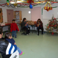 Parents and their children are just starting to arrive for the party.