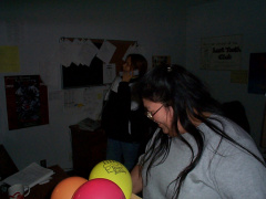 This is Mary Kakegamic getting balloons ready for the games. At the back is Karen Kakepetum.