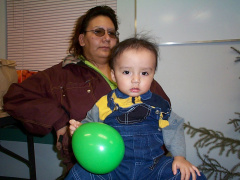 Rita Meekis and her baby grandson. They came out to enjoy the Christmas party too!  Hi cutie!