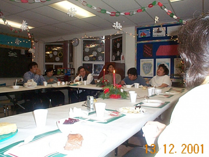 people are eating and just waiting for the dessert to be passed around and the present unwrapping