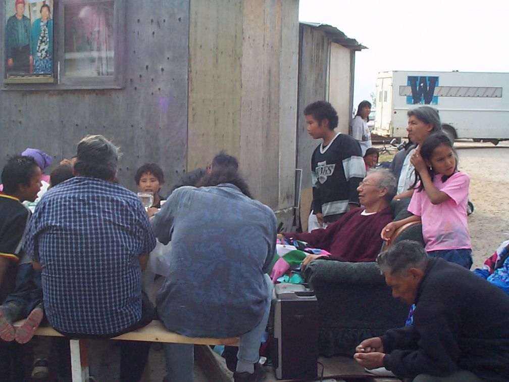 Elder Douglas Meekis surrounded by family and friends (picture of Sarah and Douglas in the upper right corner)