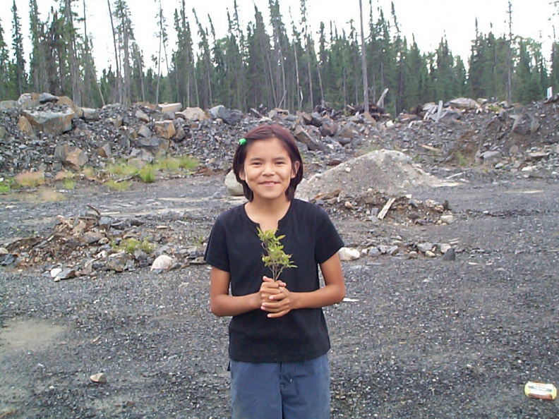 Here is Katrina Meekis holding a Low Sweet Blueberry plant.