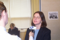 Mary Louise Hill answering questions from a local reporter of Thunder Bay Television.