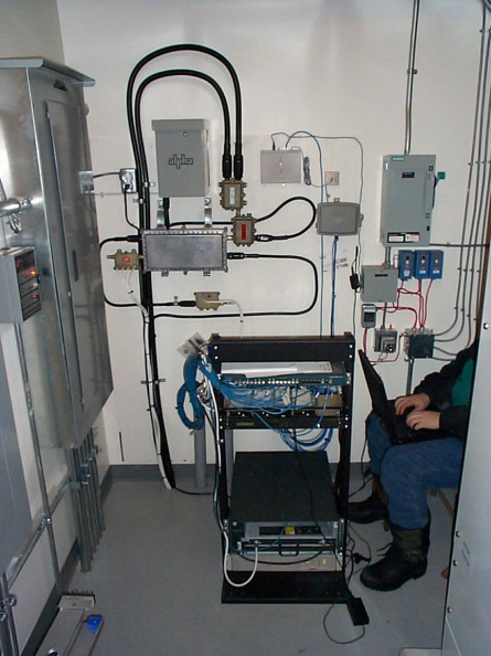 The cable headend equipment mounted to the wall in the mechanical room at the Business Center.