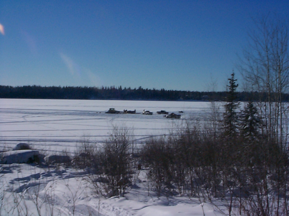 Excitement on the ice. A pickup truck broke through the ice near the winter road.