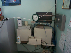The K-Net Router (DirecPC box), dialin router, Cisco router and other network equipment at the Poplar Hill school before the cab