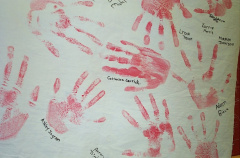 All of the students in the school decorated the gym with their handprints and names decorated on hangings around the gym.