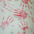 All of the students in the school decorated the gym with their handprints and names decorated on hangings around the gym.