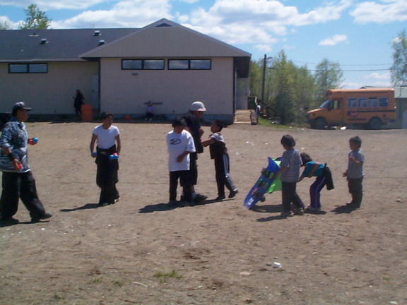 This game was called the ball toss (I think)where the children had to put a ball or two or three even into some pockets for poin