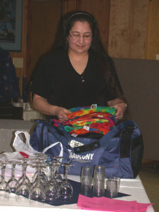 Gibbet Stevens, Telehealth Communications Coordinator for KO, organizing T-shirts for presentation.