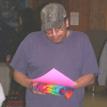 Homer Meekis, Health Director from North Spirit Lake, receiving his award and tie-dyed T-shirt.
