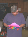 Homer Meekis, Health Director from North Spirit Lake, receiving his award and tie-dyed T-shirt.