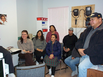 Keewaywin community members viewing the new workstation.