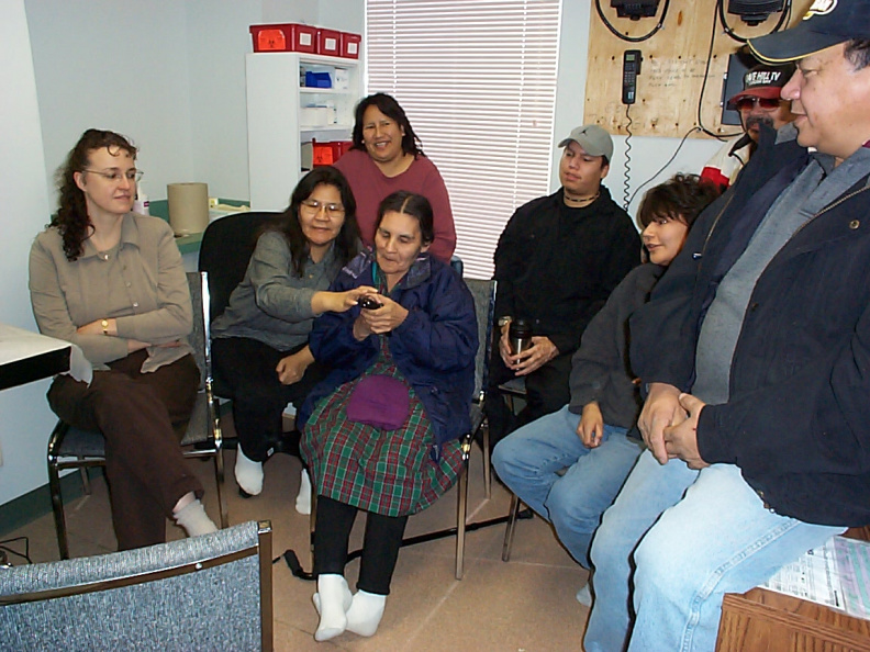 An elder from the community trying out the new telehealth equipment.