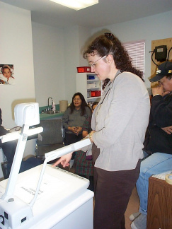 Cheryl Klassen, the nurse in Keewaywin, checking out the document camera.