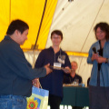 James Kakepetum, Health Director for 
Keewaywin accepting gift for Starsky, the first telehealth consult.