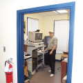 Technician from Toronto installing telehealth workstation at telehealth office in North Spirit.