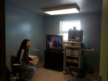 Rita Wassaykeesic, telehealth coordinator in Poplar Hill, tests the new telehealth workstation.