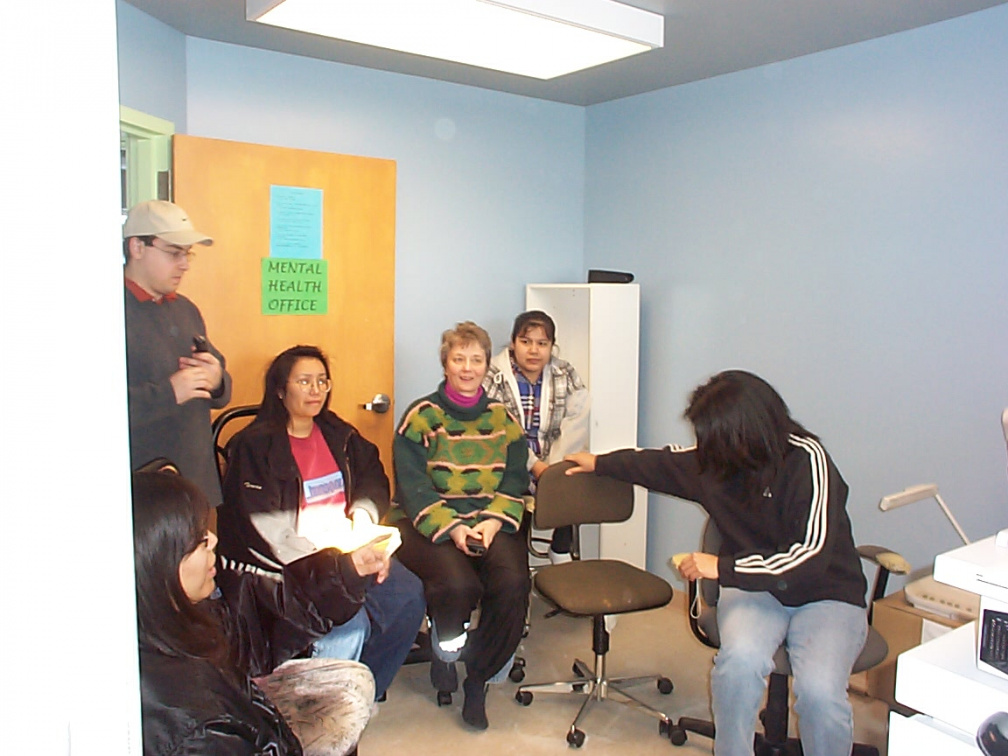 Poplar Hill community members viewing new telehealth workstation.