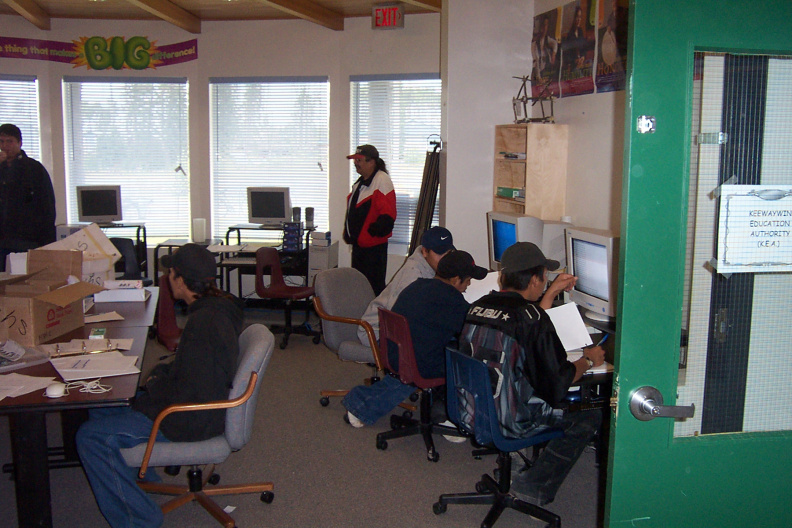 Inside the KiHS classroom during school class, and our ecentre manager looking on.