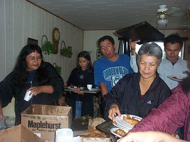 Another view of people making dinner plates