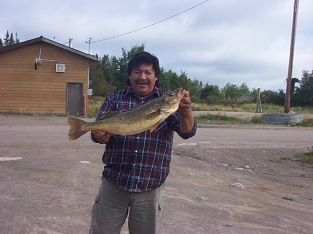 Johnny Meekis holding up David's catch