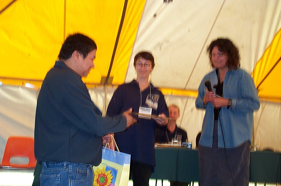 James Kakepetum, Health Director for 
Keewaywin accepting gift for Starsky, the first telehealth consult.